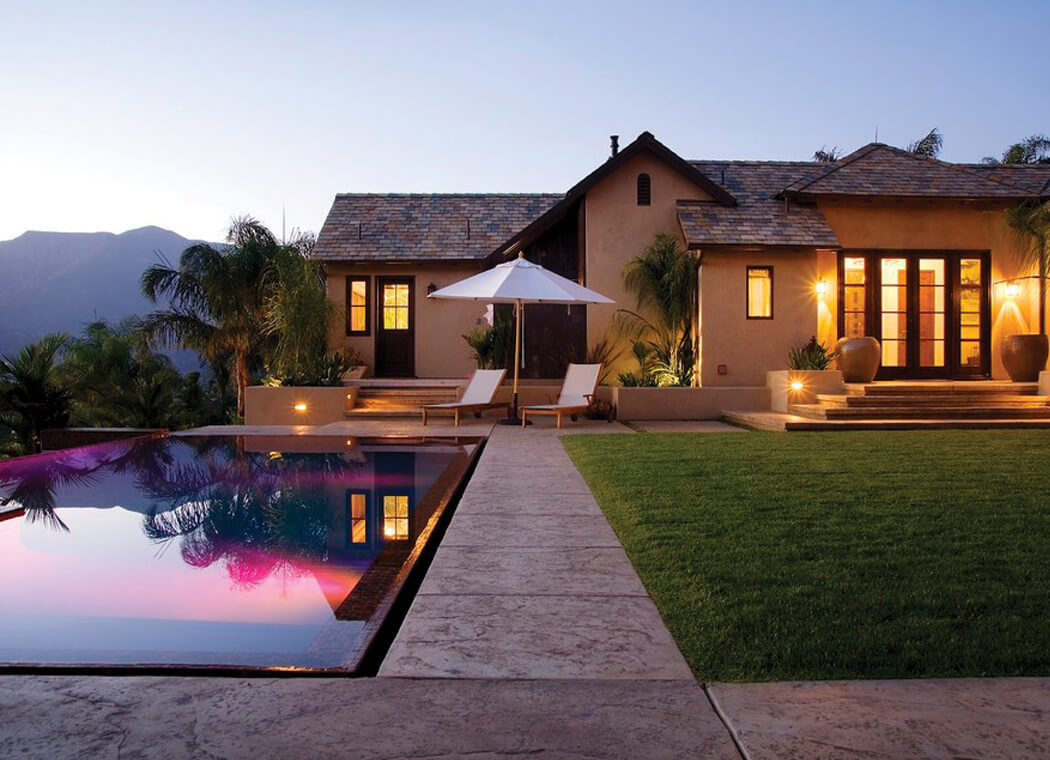 Tropical backyard with infinity pool